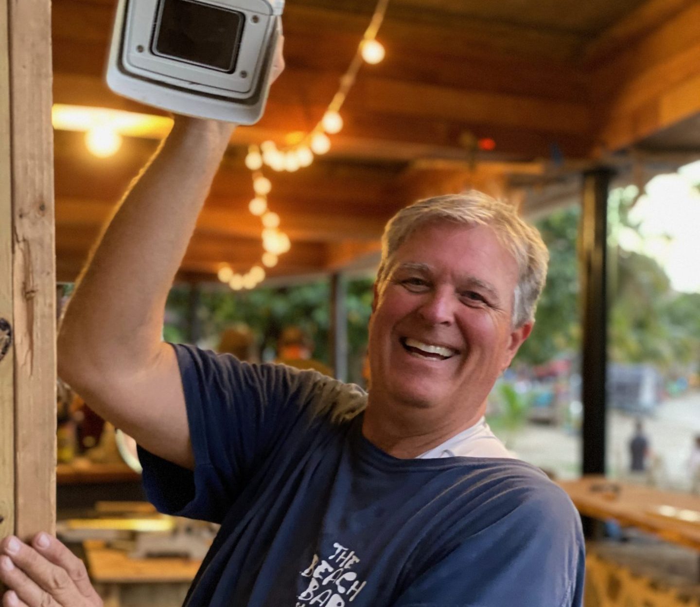 Reed Compton hanging a Beach bar webcam on St. John